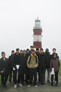  Geography students in front of lighthouse