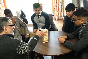  Students playing Jenga with residents at Park Lodge House