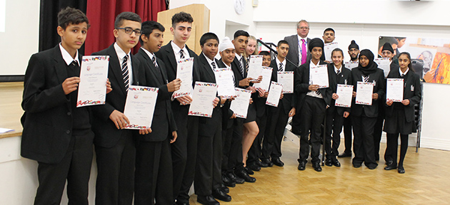  Students with Mr Ward proudly showing their BA awards