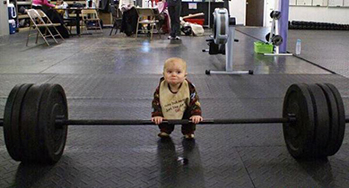  Baby attempting to lift massive weights
