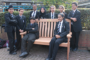 Les's Memorial Bench with students in the Quad