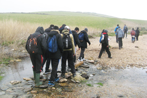  Geography students crossing river
