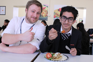  Student enjoying Kulwinder's Curry with Ryan - Head Chef 
