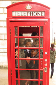 Red phonebox full of students