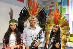  Nixiwaka with students wearing headdresses