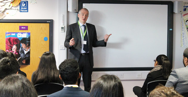  Manny Roman talks to students in the LRC