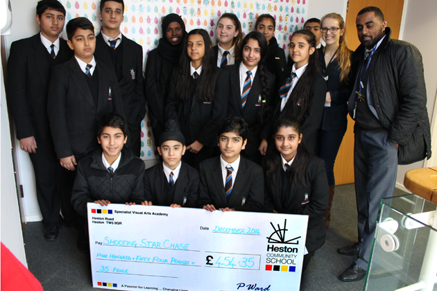  Year 8 hand over the cheque to Ellie from Shooting Star Chase