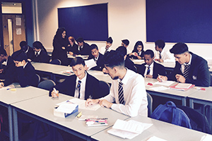  Year 11 students mentoring Year 7s